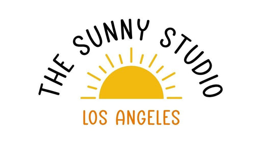 Logo of The Sunny Studio Los Angeles with a yellow sun graphic on a white background